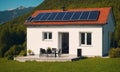 Modern house with solar panels on roof. Alternative energy source in the countryside Royalty Free Stock Photo