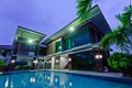 Modern house with swimming pool at night Royalty Free Stock Photo