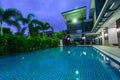 Modern house with swimming pool at night Royalty Free Stock Photo
