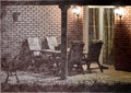 Modern house terrace with garden furniture at night. Collage of classic photograph and charcoal or graphite drawing. Royalty Free Stock Photo