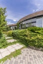 Modern housefront surrounded by plants