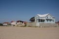 Modern houses on the sea sand beach Royalty Free Stock Photo