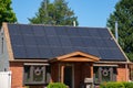 Modern houses with solar panels on the roof for alternative energy Royalty Free Stock Photo