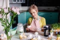 Modern housewife cooks in the kitchen. portrait of a woman cook with mixer. Preparing for Easter Royalty Free Stock Photo