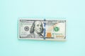 Modern hundred us dollar bills on blue background. Financial USA money banknote Royalty Free Stock Photo