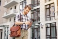 Smart young man using his mobile phone