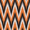 Modern Ikat Autumn Ember: Chevron Zigzag Pattern in Orange, Black, and White with Fiery Rhythm Royalty Free Stock Photo
