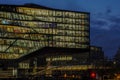 Modern illuminated building amsterdam night cityscape from canals