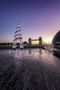 Christmas tree in front of the iconic Tower Bridge, United Kingdom Royalty Free Stock Photo