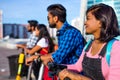 Modern indian friends ride on segway in park in India