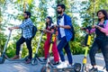 Modern indian friends ride on segway in park in India