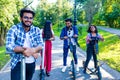 modern indian friends ride on segway in park in India