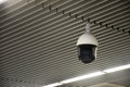 Modern indoors security CCTV camera or surveillance system on ceiling in the airport