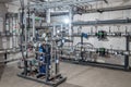 Modern industrial building with pipes, heat exchangers and valves Royalty Free Stock Photo