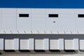 Modern industrial warehouse building featuring multiple loading docks Royalty Free Stock Photo