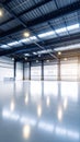 Modern industrial warehouse interior with high ceiling and large overhead doors Royalty Free Stock Photo