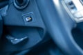 Modern interior of an automobile with a closeup of a steering wheel