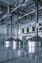 Modern interior of a brewery mash vats metal containers Royalty Free Stock Photo