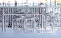 Modern interior of cafeteria or canteen with stainless steel chairs and tables Royalty Free Stock Photo