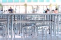 Modern interior of cafeteria or canteen with stainless steel chairs and tables Royalty Free Stock Photo