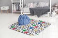Modern interior of the child`s bedroom with carpet and bag in front Royalty Free Stock Photo