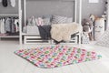 Modern interior of the child`s bedroom with carpet in front Royalty Free Stock Photo