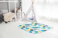 Modern interior of the child`s bedroom with carpet in front Royalty Free Stock Photo