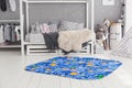 Modern interior of the child`s bedroom with carpet in front Royalty Free Stock Photo