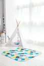 Modern interior of the child`s bedroom with carpet in front Royalty Free Stock Photo