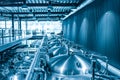 Private microbrewery. Modern beer plant with brewering kettles, tubes and tanks made of stainless steel Royalty Free Stock Photo