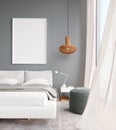 Modern interior design of bedroom with white bed and empty mock up picture frame Royalty Free Stock Photo