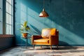 Modern interior design of dark blue room with leather armchair and wooden side table near hanging lamp on wall background Royalty Free Stock Photo