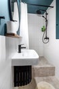 Modern interior design of a small bathroom. Blue style. Black plumbing Royalty Free Stock Photo