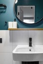 Modern interior design of a small bathroom. Blue style. Black plumbing Royalty Free Stock Photo
