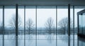 Modern Interior with Large Windows Overlooking Bare Trees in Winter architecture building Royalty Free Stock Photo