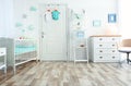 Modern interior of light cozy baby room Royalty Free Stock Photo