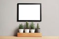 Modern interior living room design mockup with a large blank empty white board poster above four potted plants