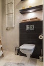 Modern interior of new studio apartment with modern decorations, big toilet with shower and washing machine, equipped kitchen