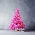Modern interior with pink Christmas tree and greetings Royalty Free Stock Photo