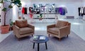 Modern interior with soft velvet chairs in boutique elegant clothes