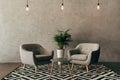 modern interior with vintage furniture in loft style with concrete wall Royalty Free Stock Photo