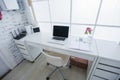 Modern interior workplace with laptop in white colors Royalty Free Stock Photo