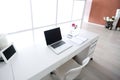 Modern interior workplace with laptop in white colors Royalty Free Stock Photo