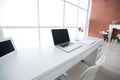 Modern interior workplace with laptop in white colors Royalty Free Stock Photo