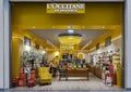 Modern interior in yellow colors of L`Occitane En Provence skincare boutique