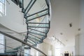 Modern interiro of luxury private house. Glass metal spiral staircase. Royalty Free Stock Photo