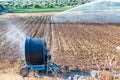 Modern irrigators on a contryside field