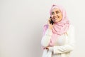 A young muslim woman wearing hijab using a smartphone Royalty Free Stock Photo