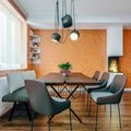 Modern italian design dining room with small fireplace and orange plaster walls, mock-up