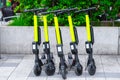 Modern ÃÂity transport - Five electric scooters are parked on the street of the city